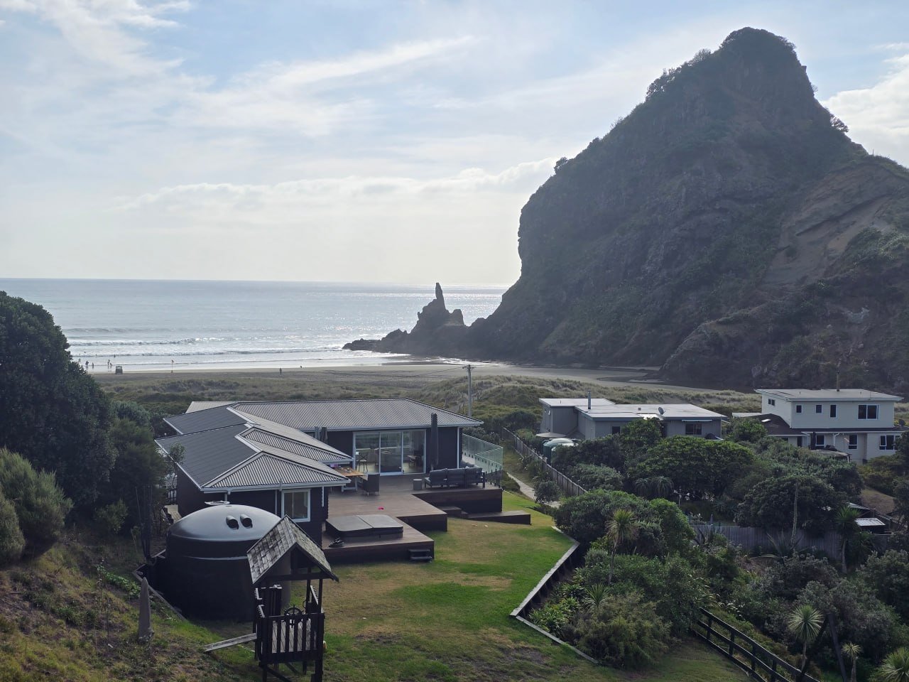 The view from Te Piha across to Lion Rock and the beach