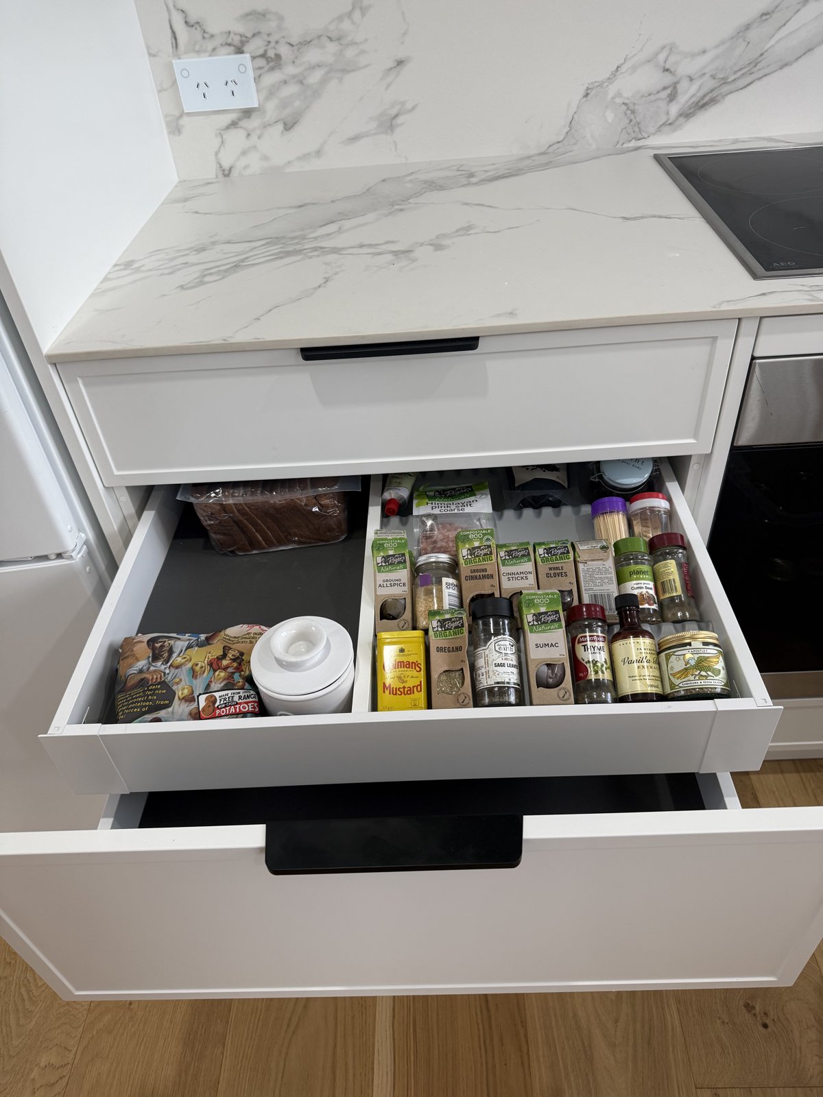 Hidden spice drawer between fridge and oven